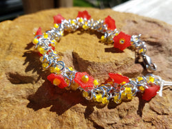 Red Lucite Flowers and Peach Shaggy Bracelet