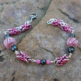 Pink lampwork with hot pink byzantine